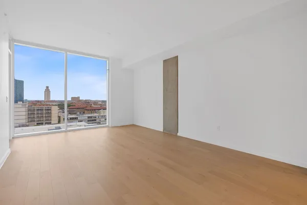 a view of an empty room with a balcony