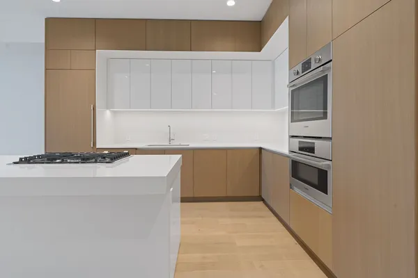 a kitchen with a sink and cabinets
