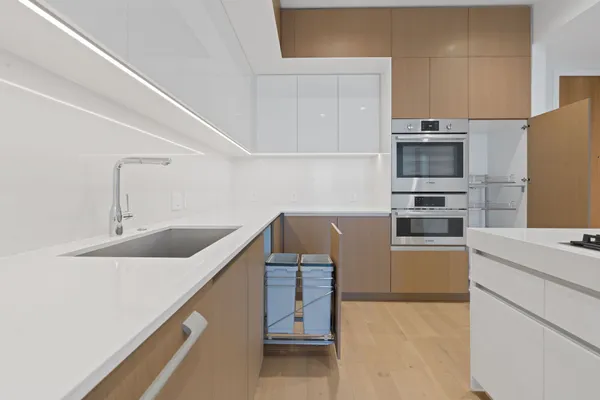 a kitchen with stainless steel appliances a refrigerator and a sink