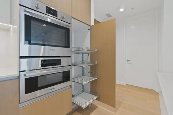 a kitchen with a stove and a microwave