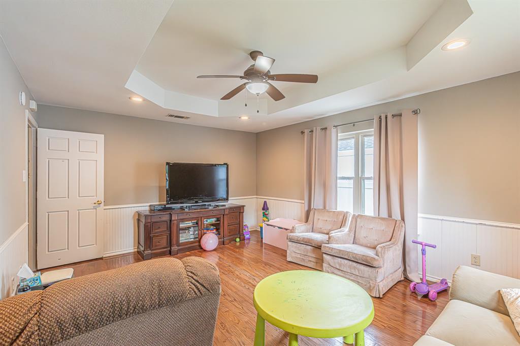 3309 Timber View Circle Bedford, TX 76021 - Photo 21 of 38 a living room with furniture and a flat screen tv