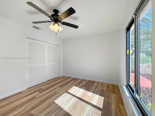 a view of room with a ceiling fan