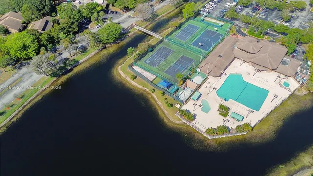 an aerial view of a house with a ocean view