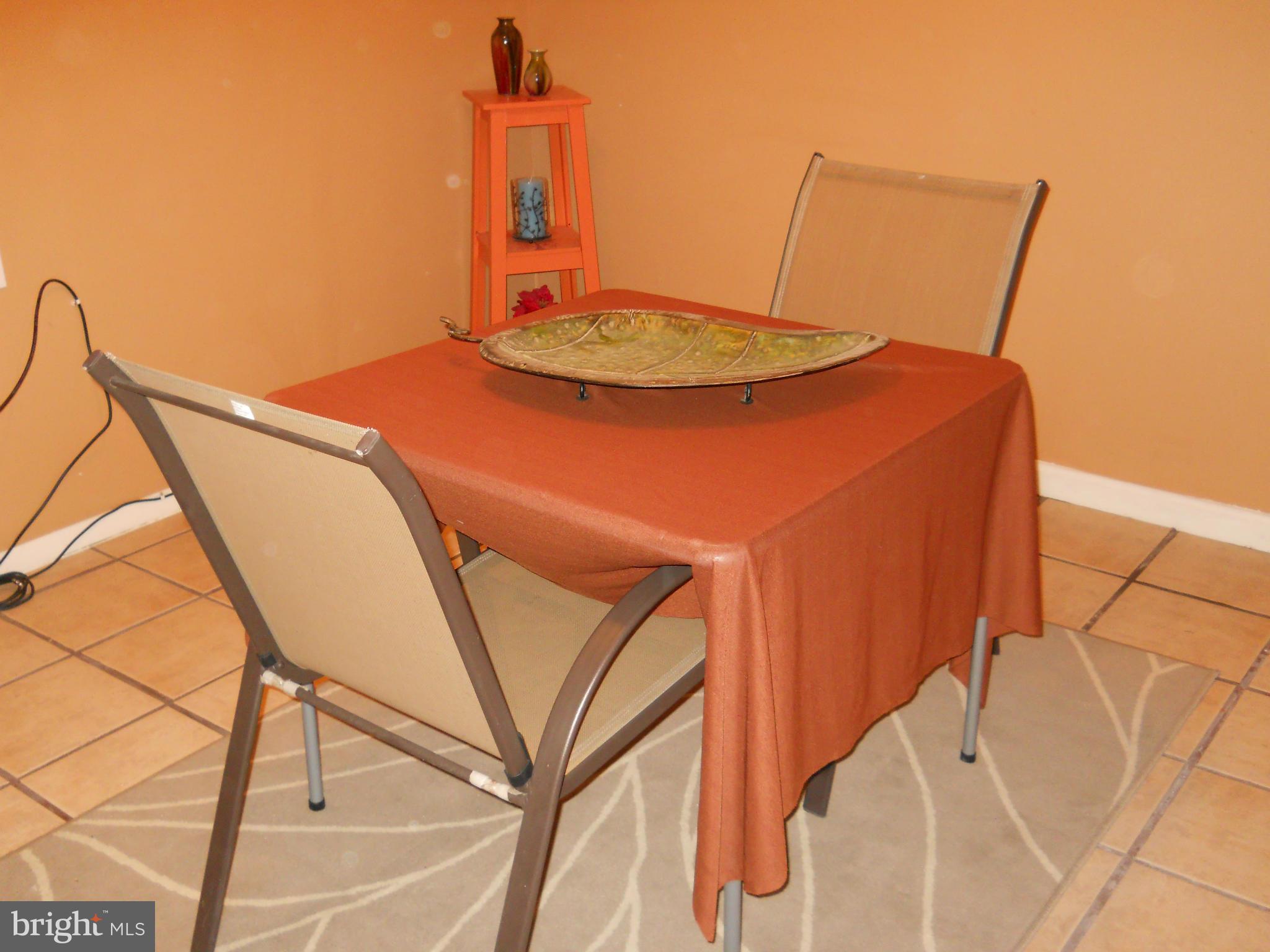 7411 Sudbrook Road Baltimore, MD 21208 - Photo 16 of 30 a balcony with table and chairs