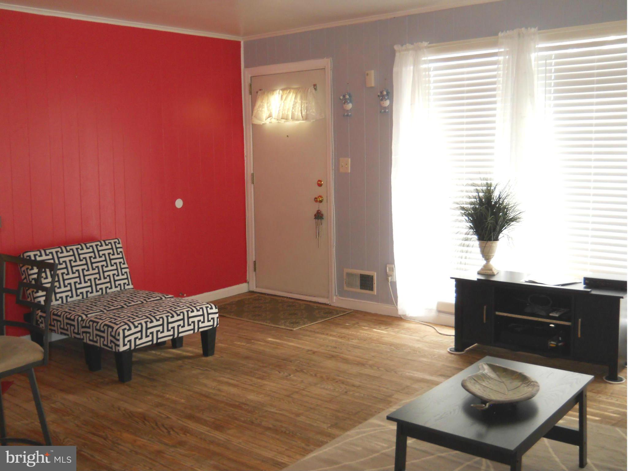 7411 Sudbrook Road Baltimore, MD 21208 - Photo 3 of 30 a living room with furniture