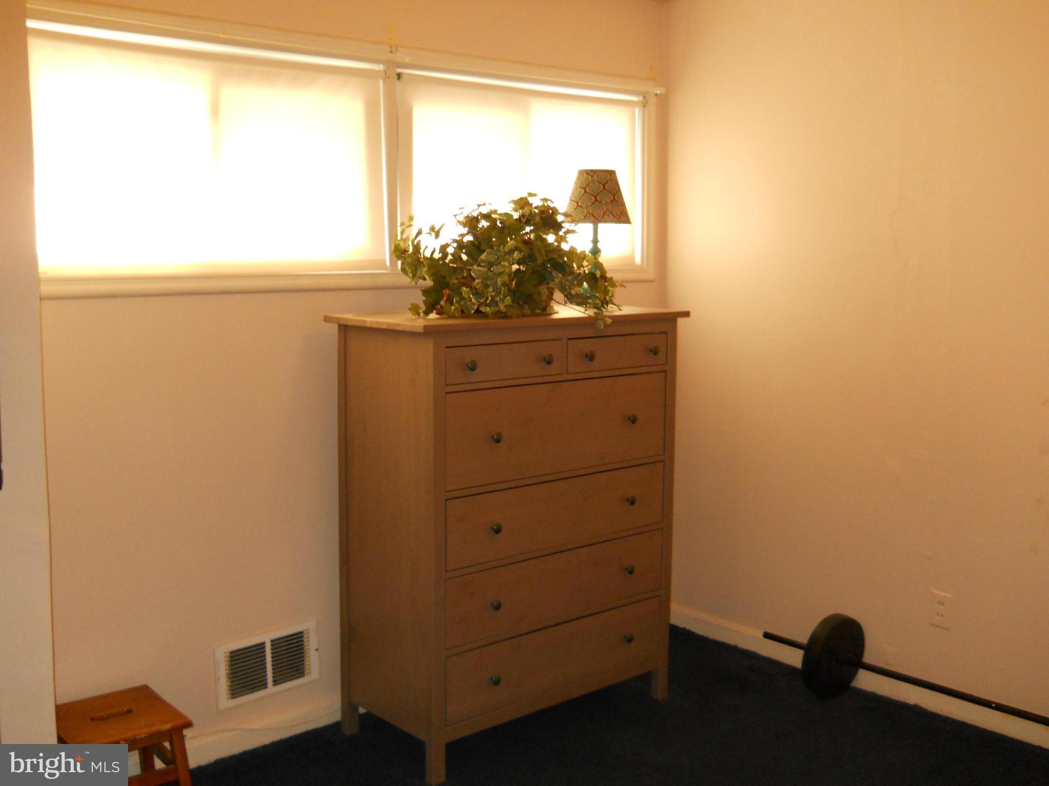 7411 Sudbrook Road Baltimore, MD 21208 - Photo 23 of 30 a view of a dresser