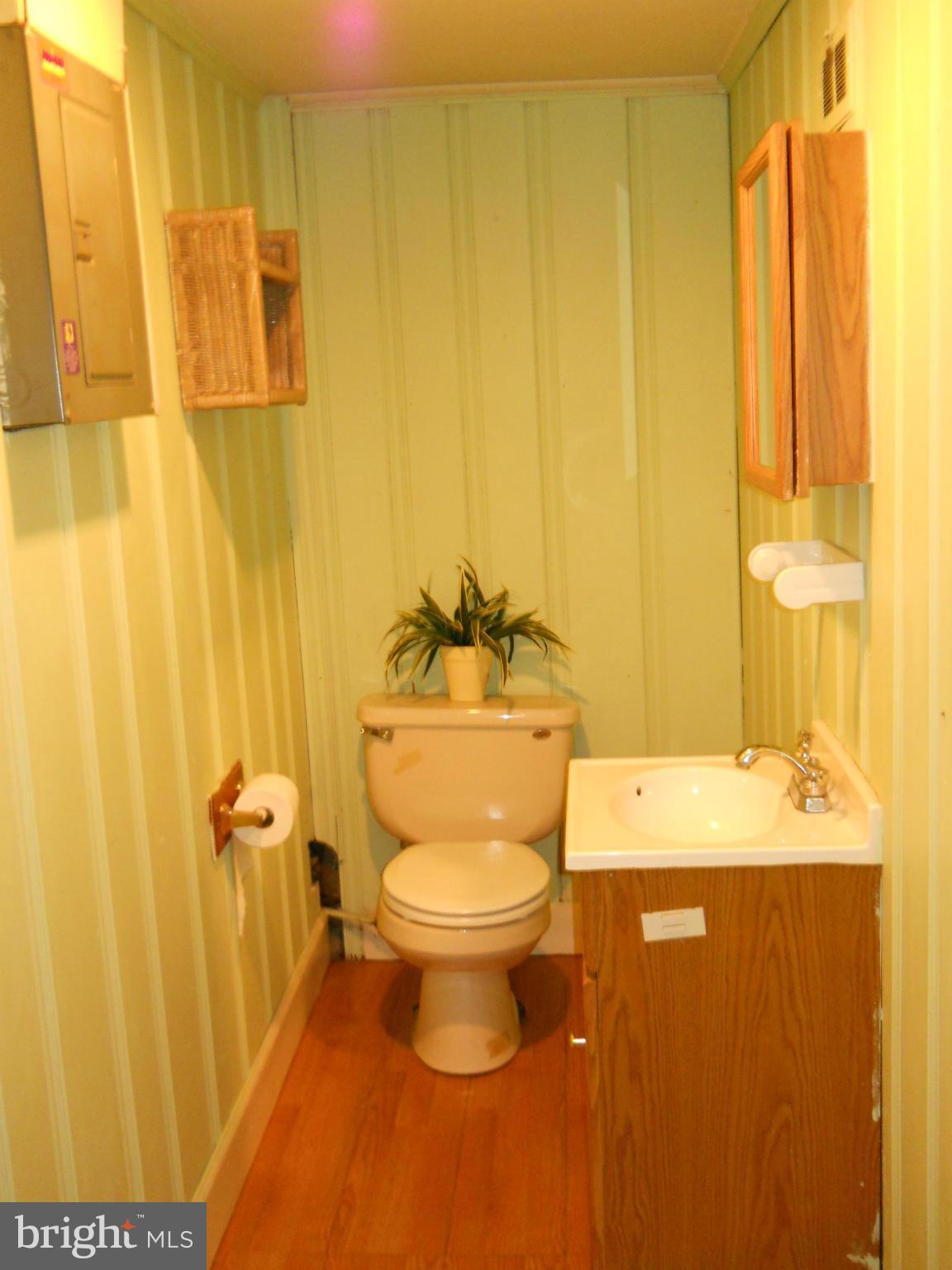7411 Sudbrook Road Baltimore, MD 21208 - Photo 29 of 30 a bathroom with a sink and a toilet