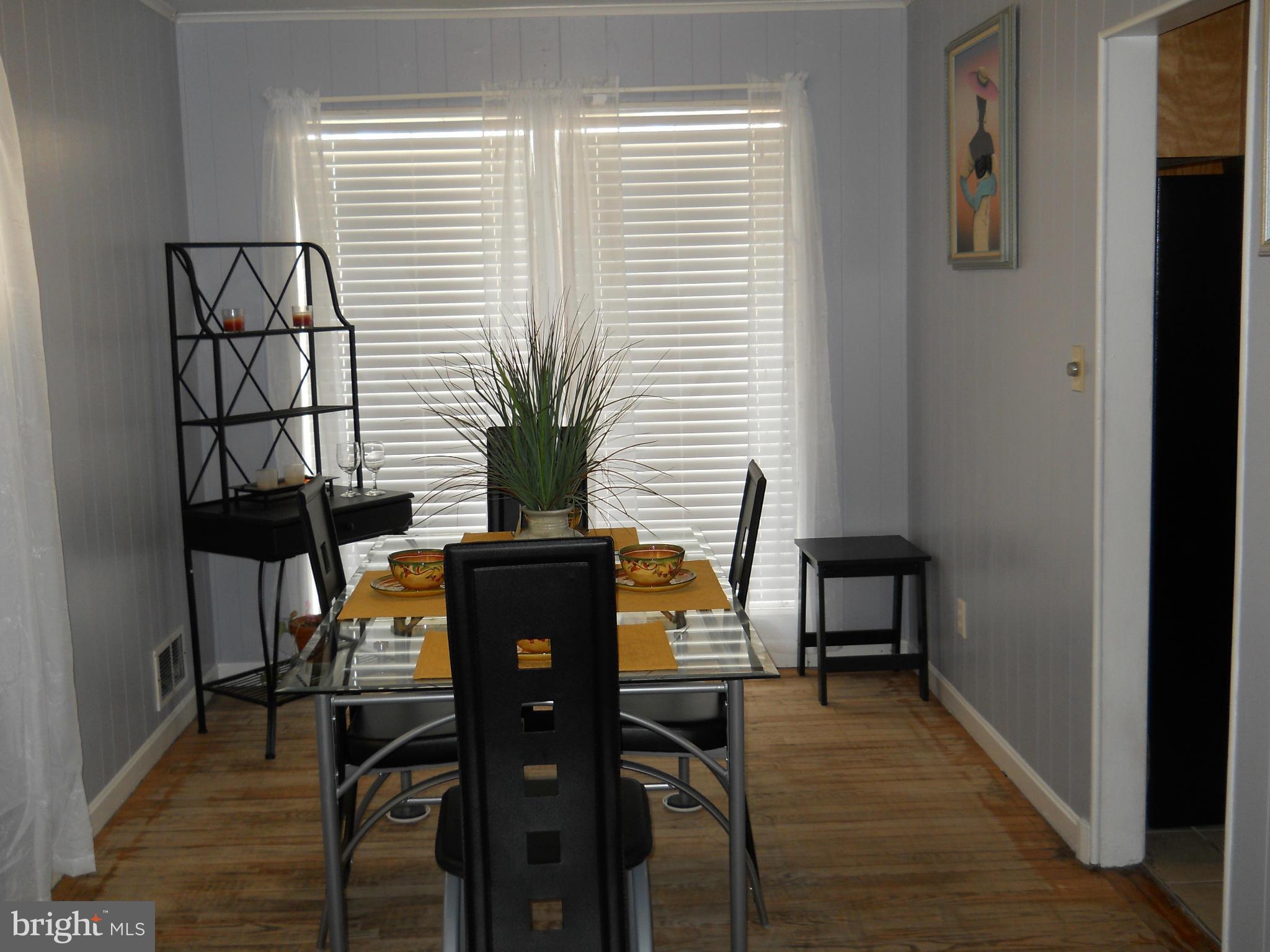 7411 Sudbrook Road Baltimore, MD 21208 - Photo 8 of 30 a view of a livingroom with furniture and a potted plant