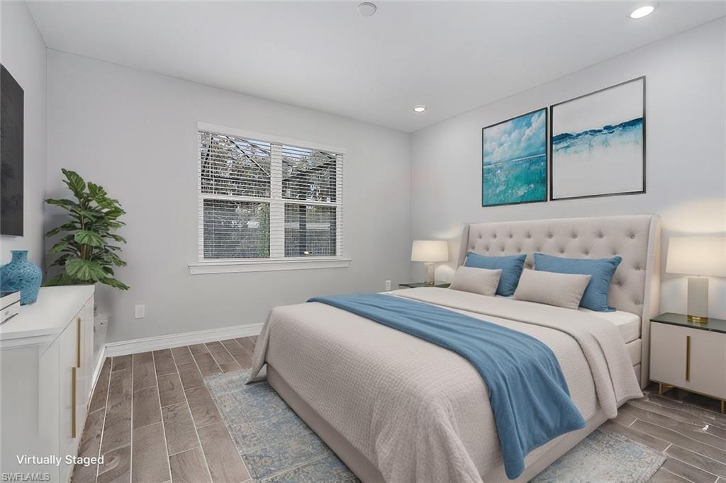 28367 Captiva Shell Loop Bonita Springs, FL 34135 - Photo 14 of 36 a bedroom with a large bed and a window