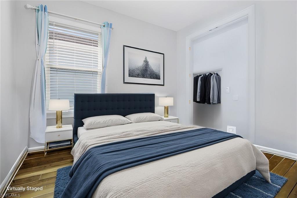 28367 Captiva Shell Loop Bonita Springs, FL 34135 - Photo 18 of 36 a bedroom with a bed and a lamp on table