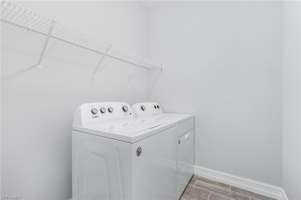 28367 Captiva Shell Loop Bonita Springs, FL 34135 - Photo 22 of 36 a utility room with dryer and washer