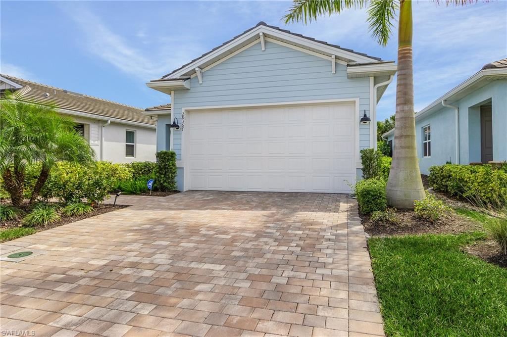 28367 Captiva Shell Loop Bonita Springs, FL 34135 - Photo 24 of 36 a view of a house with a yard