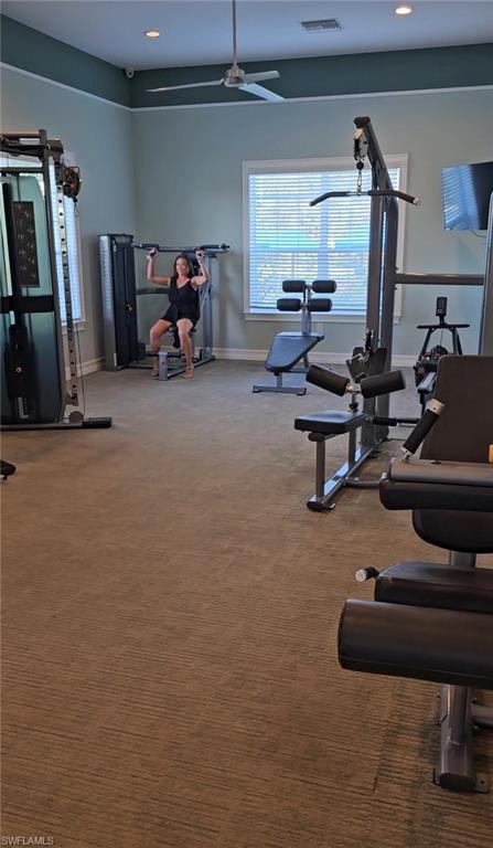 28367 Captiva Shell Loop Bonita Springs, FL 34135 - Photo 27 of 36 a living room with furniture and a gym machine