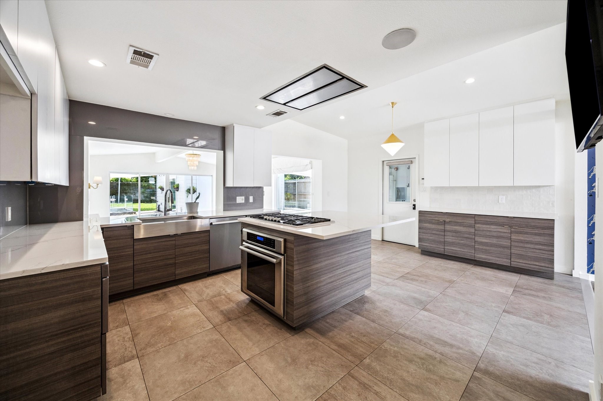 5231 Lamonte Lane Houston, TX 77092 - Photo 11 of 41 a large kitchen with stainless steel appliances and large windows