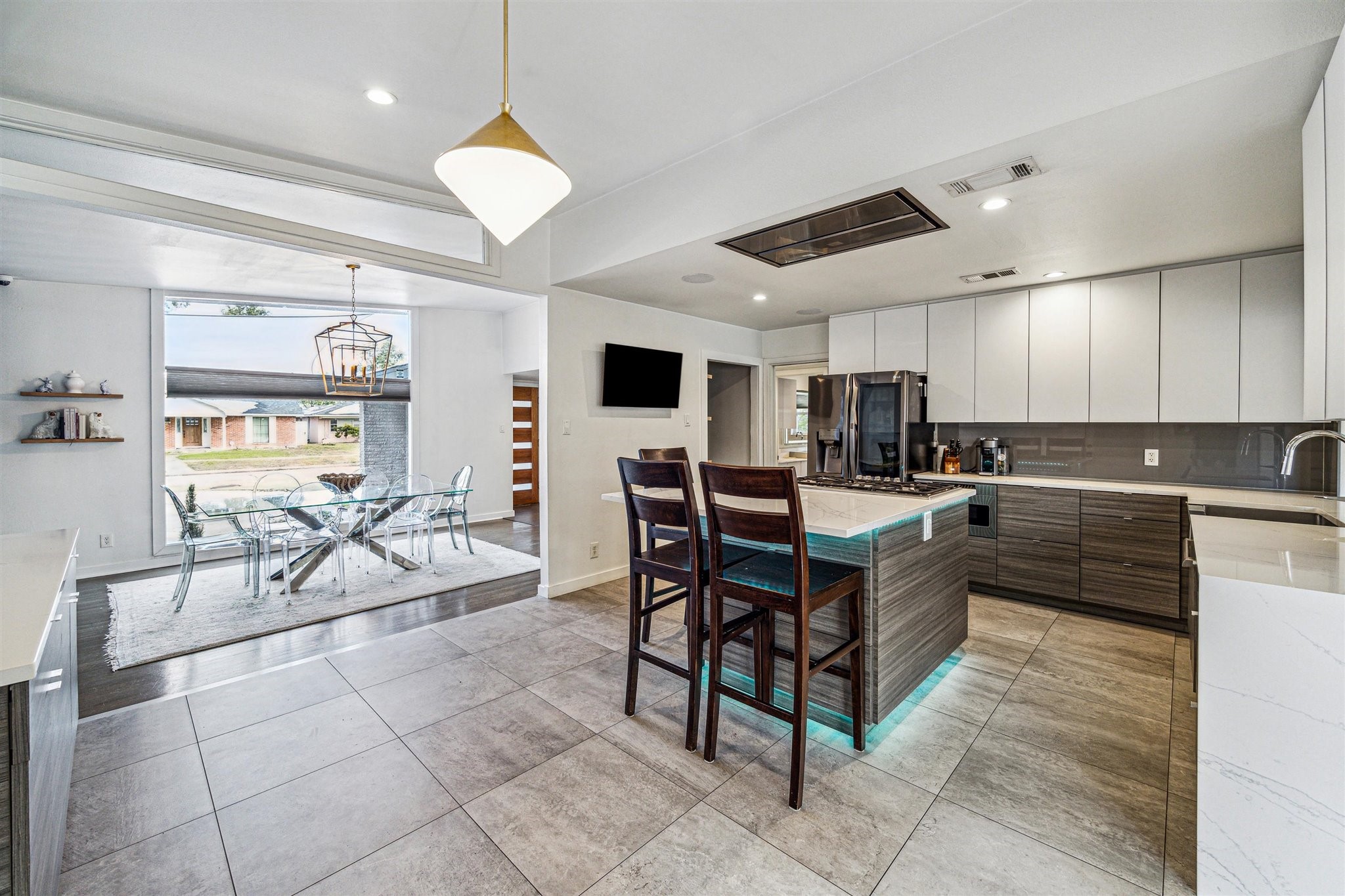 5231 Lamonte Lane Houston, TX 77092 - Photo 12 of 41 a kitchen with stainless steel appliances kitchen island granite countertop a sink dishwasher a dining table and chairs with the view of kitchen