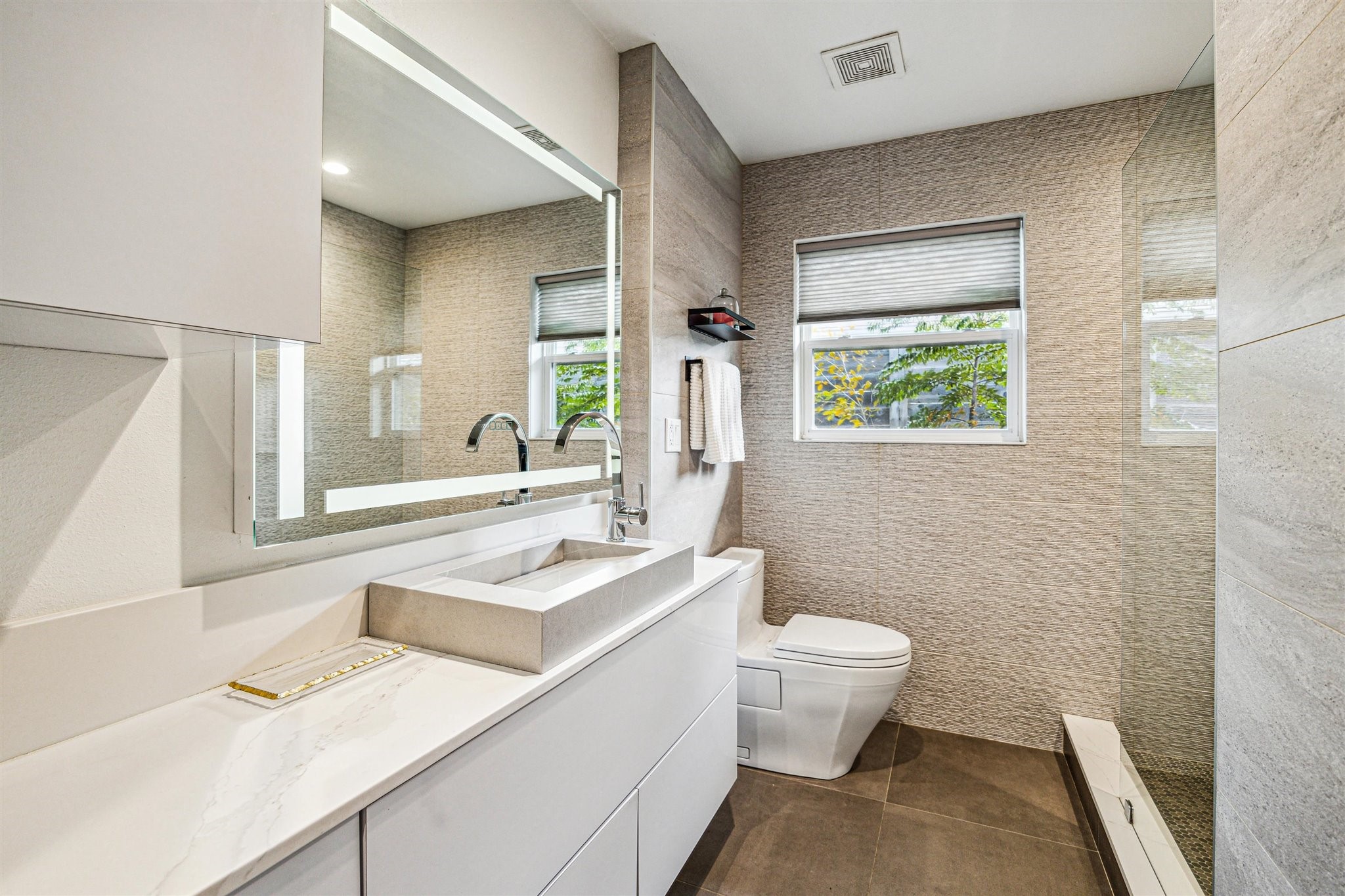 5231 Lamonte Lane Houston, TX 77092 - Photo 31 of 41 a bathroom with a sink a toilet and a window