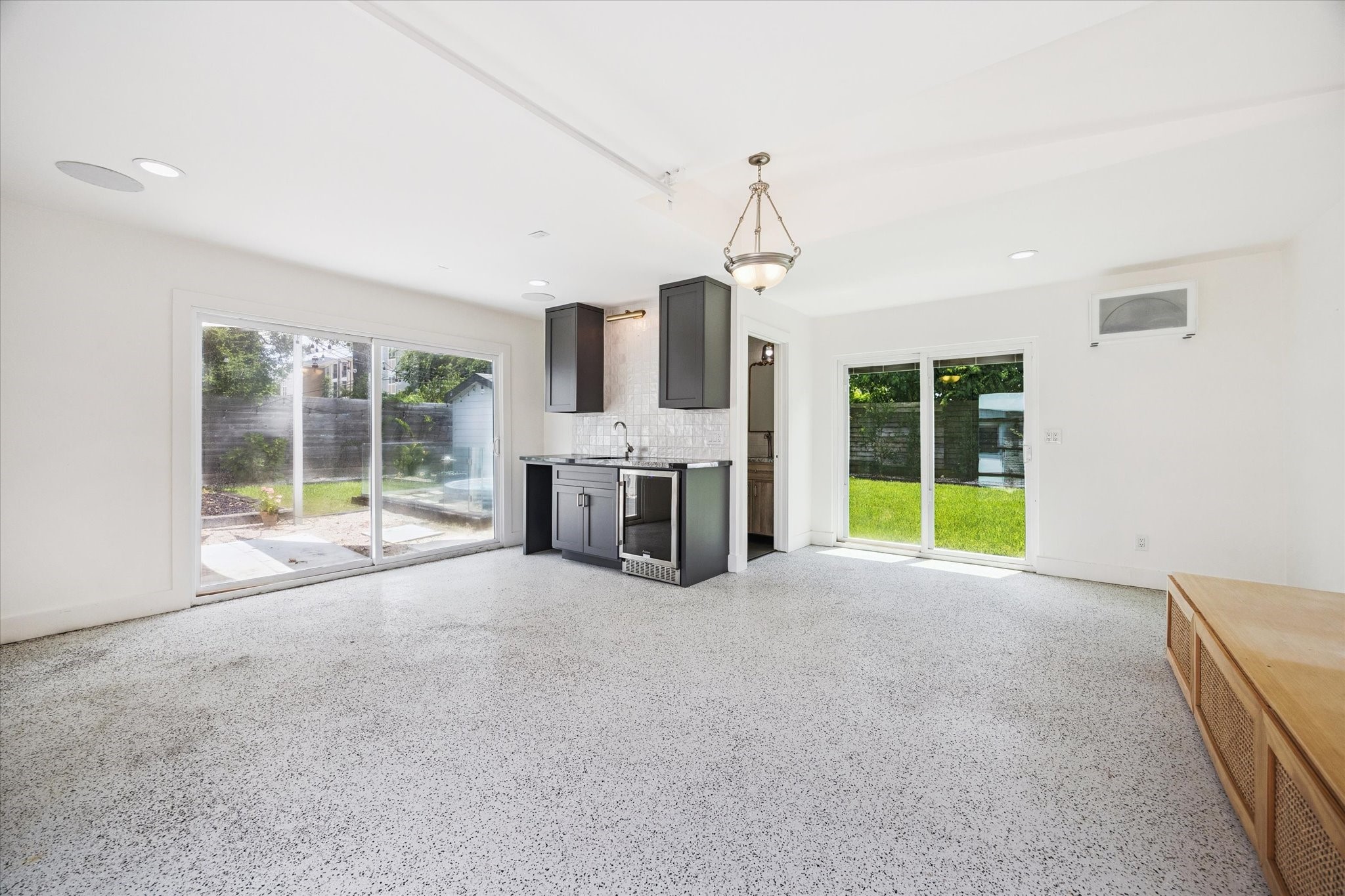 5231 Lamonte Lane Houston, TX 77092 - Photo 33 of 41 a view of an empty room with a fireplace and a large window