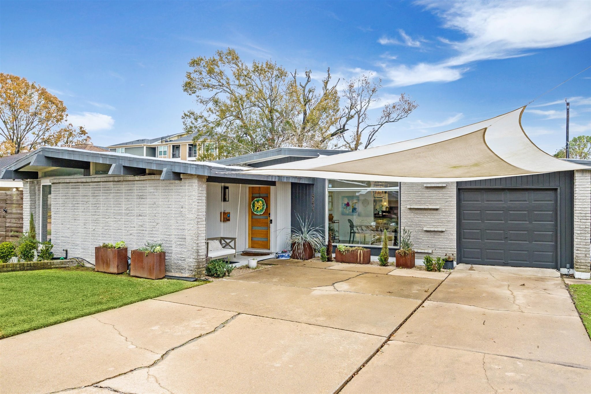 5231 Lamonte Lane Houston, TX 77092 - Photo 41 of 41 a front view of a house with a garden and plants