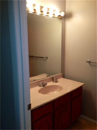 71 Round House Road, Unit 71 Bourne, MA 02532 - Photo 17 of 25 a bathroom with a sink vanity and a mirror