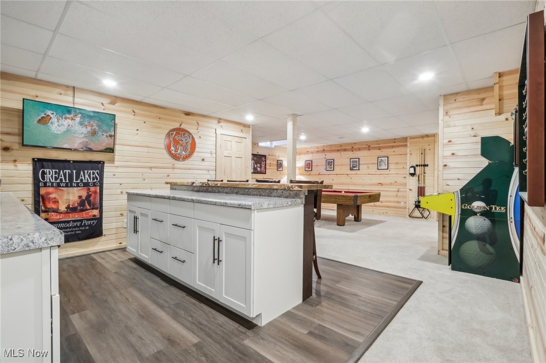 6172 Case Road North Ridgeville, OH 44039 - Photo 34 of 49 Basement Bar featuring white cabinetry, wooden walls, dark colored carpet, and pool table