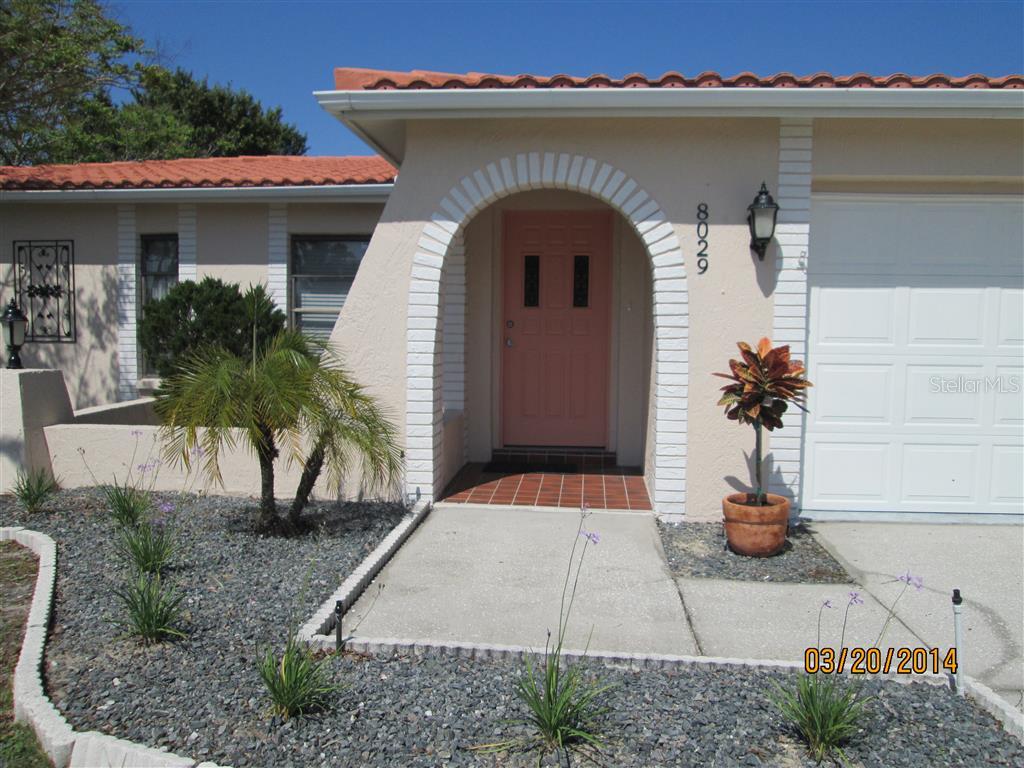 8029 Laurel Vista Loop Port Richey, FL 34668 - Photo 1 of 1 a house view with a outdoor space