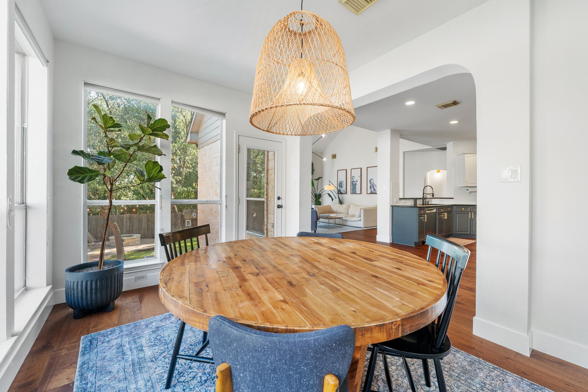 3417 Grimes Ranch Road Austin, TX 78732 - Photo 12 of 40 a view of a dining room with furniture window and wooden floor
