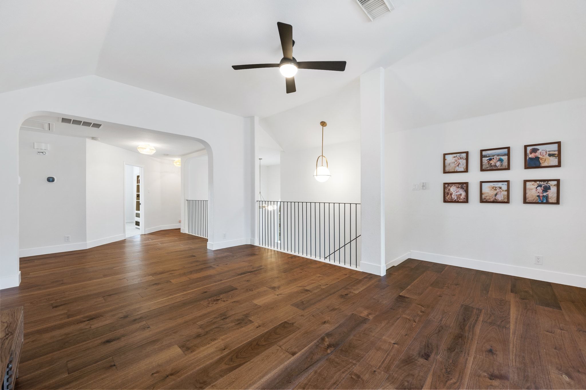 3417 Grimes Ranch Road Austin, TX 78732 - Photo 24 of 40 a view of a room with wooden floor and a ceiling fan