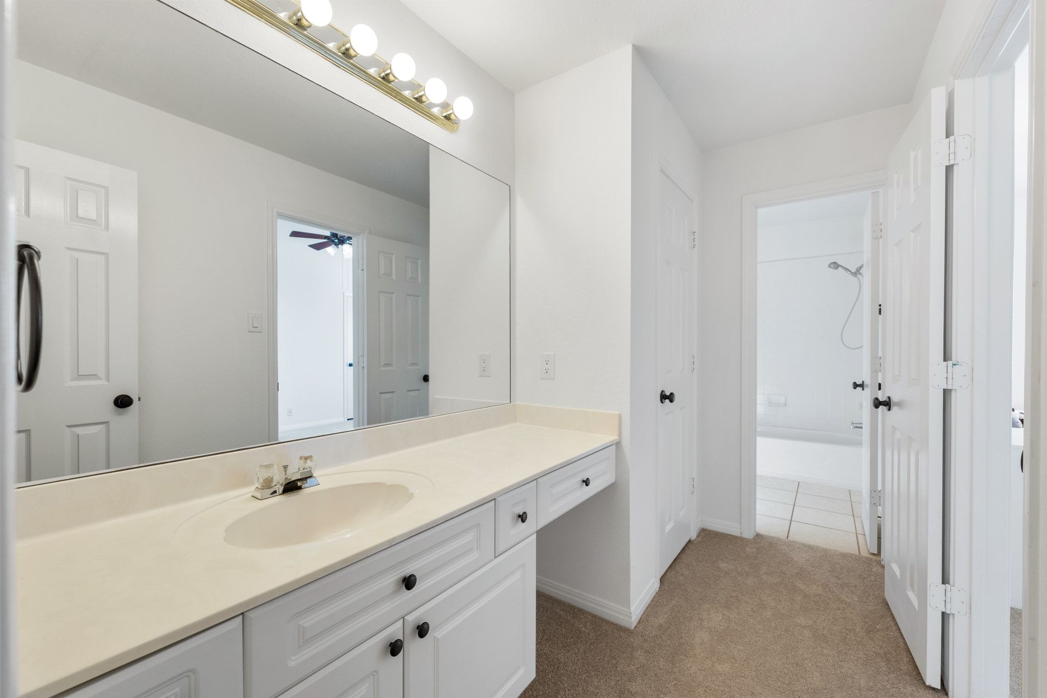 3417 Grimes Ranch Road Austin, TX 78732 - Photo 31 of 40 a spacious bathroom with a double vanity sink and a mirror