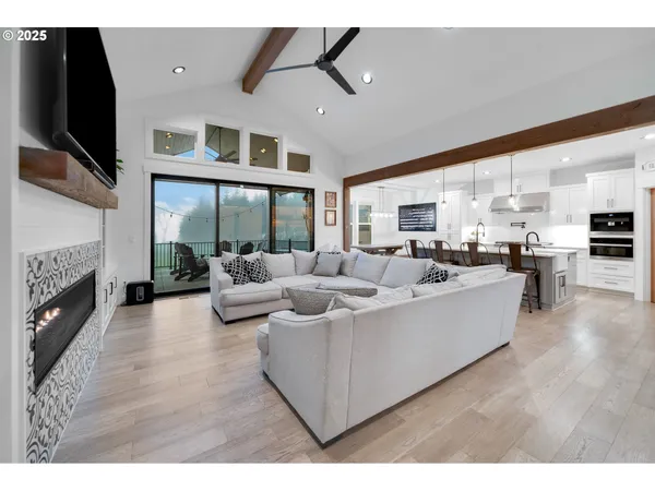 a living room with furniture fireplace and flat screen tv