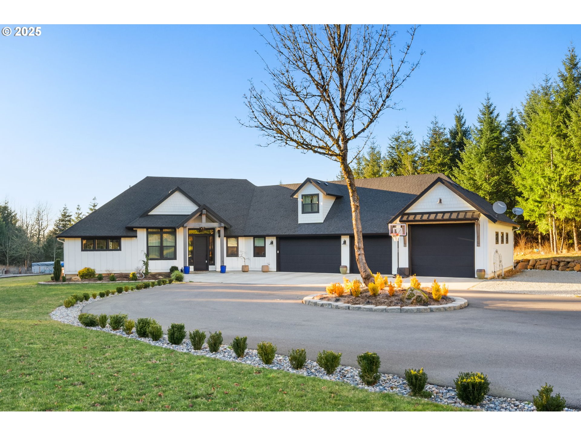 17211 Northeast Yacolt Mountain Road Yacolt, WA 98675 - Photo 2 of 44 a front view of a house with a garden and tree