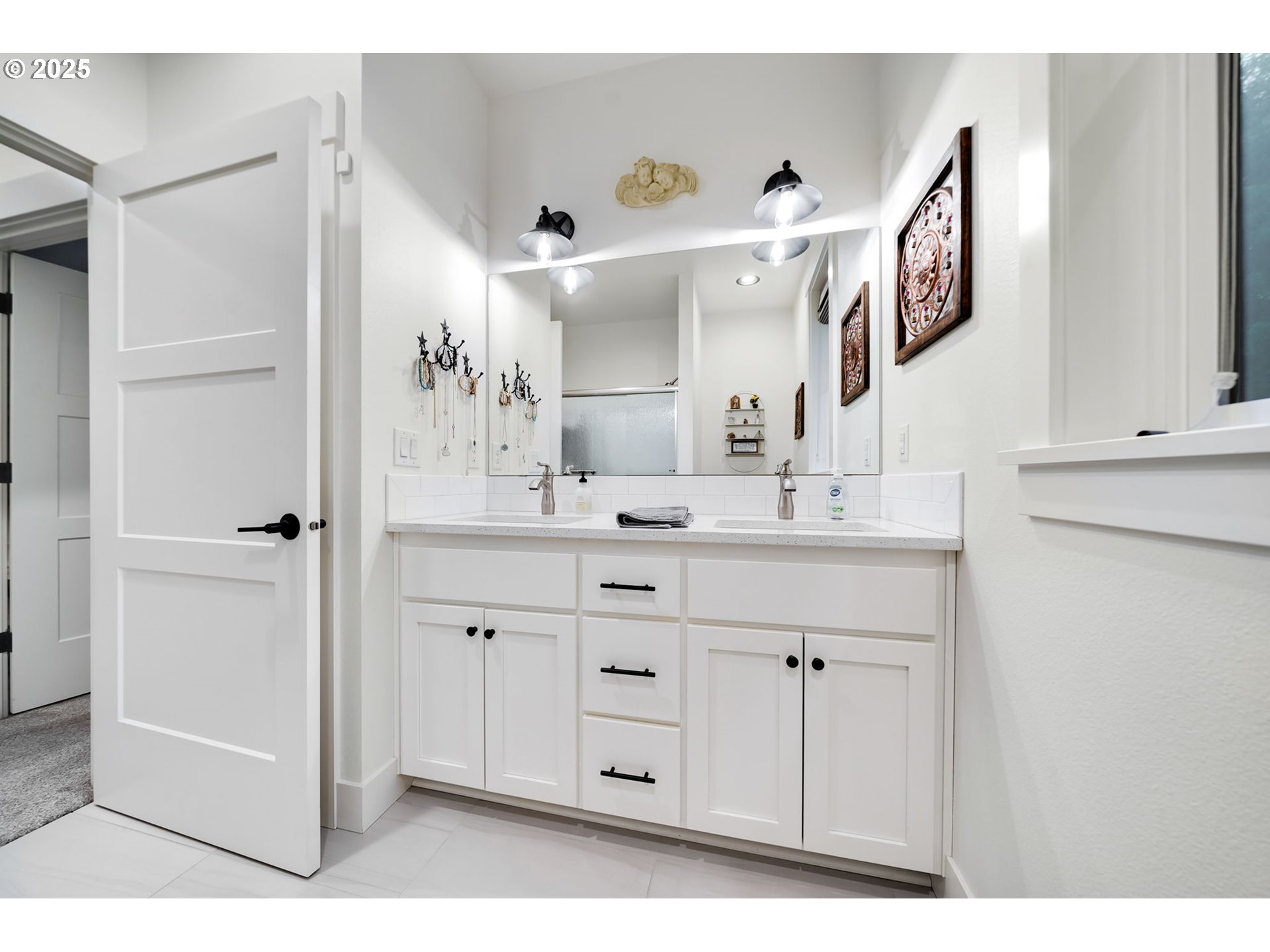 17211 Northeast Yacolt Mountain Road Yacolt, WA 98675 - Photo 31 of 44 a bathroom with a double vanity sink and a mirror