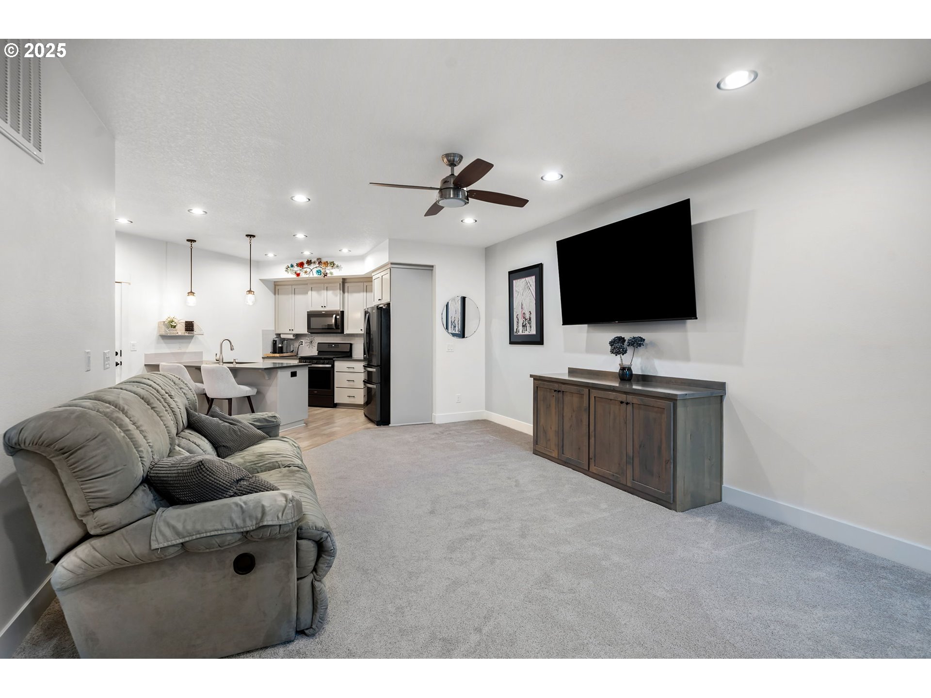 17211 Northeast Yacolt Mountain Road Yacolt, WA 98675 - Photo 37 of 44 a living room with furniture and a flat screen tv
