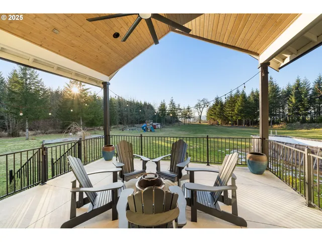 a view of a chair and tables in the balcony