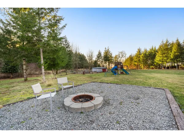 a view of a backyard with swimming pool