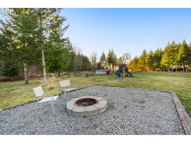 a view of a backyard with swimming pool