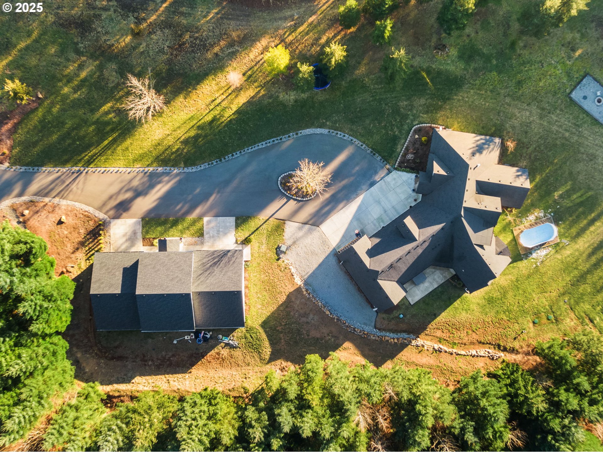 17211 Northeast Yacolt Mountain Road Yacolt, WA 98675 - Photo 7 of 44 an aerial view of a house with a yard and garden