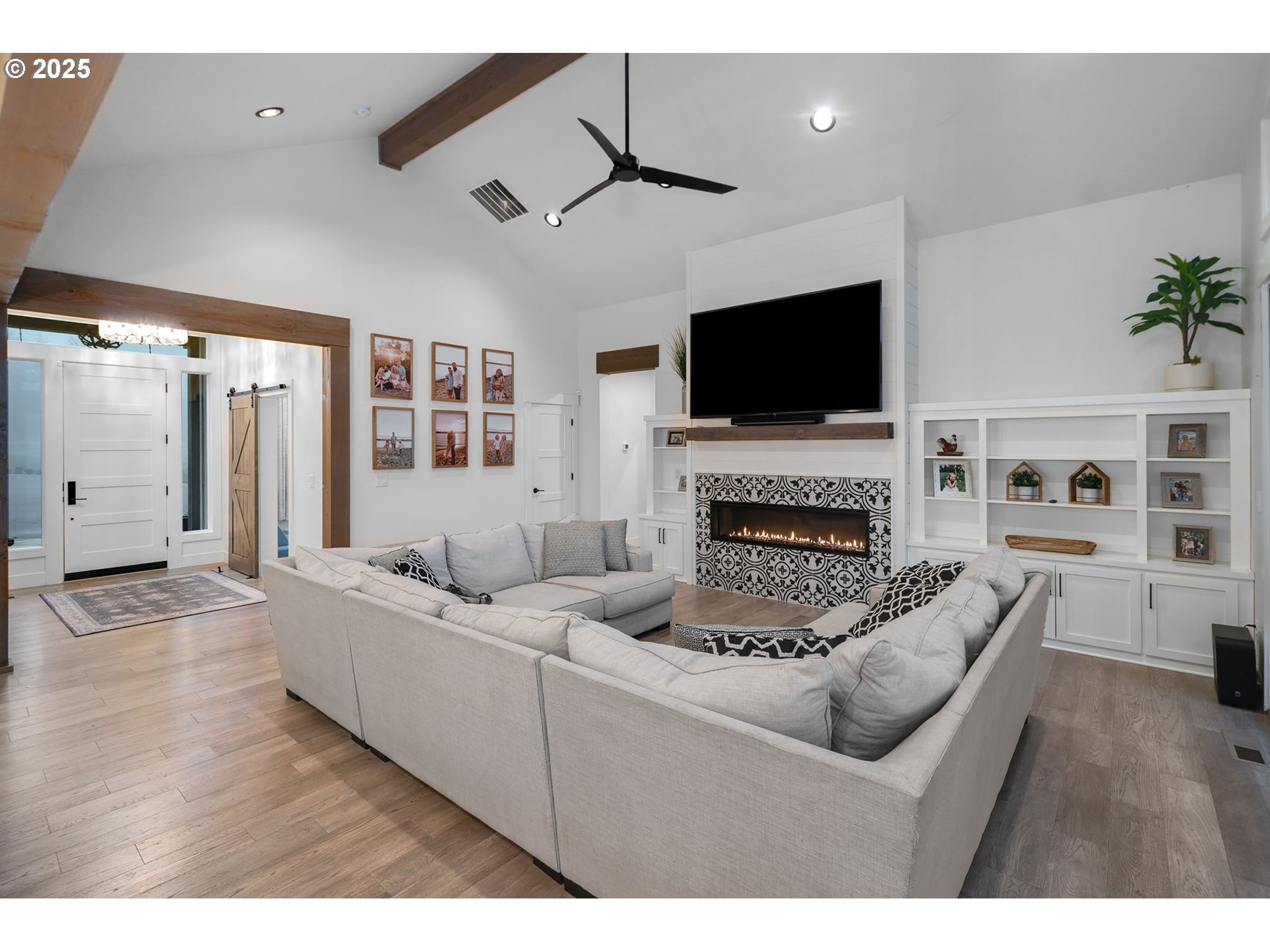17211 Northeast Yacolt Mountain Road Yacolt, WA 98675 - Photo 10 of 44 a living room with furniture a flat screen tv and a fireplace