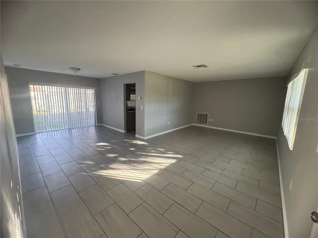 a view of an empty room and window