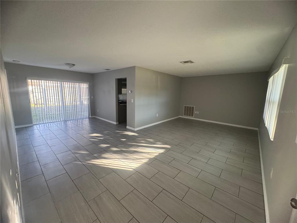 13016 Sirius Lane Hudson, FL 34667 - Photo 7 of 13 a view of an empty room and window