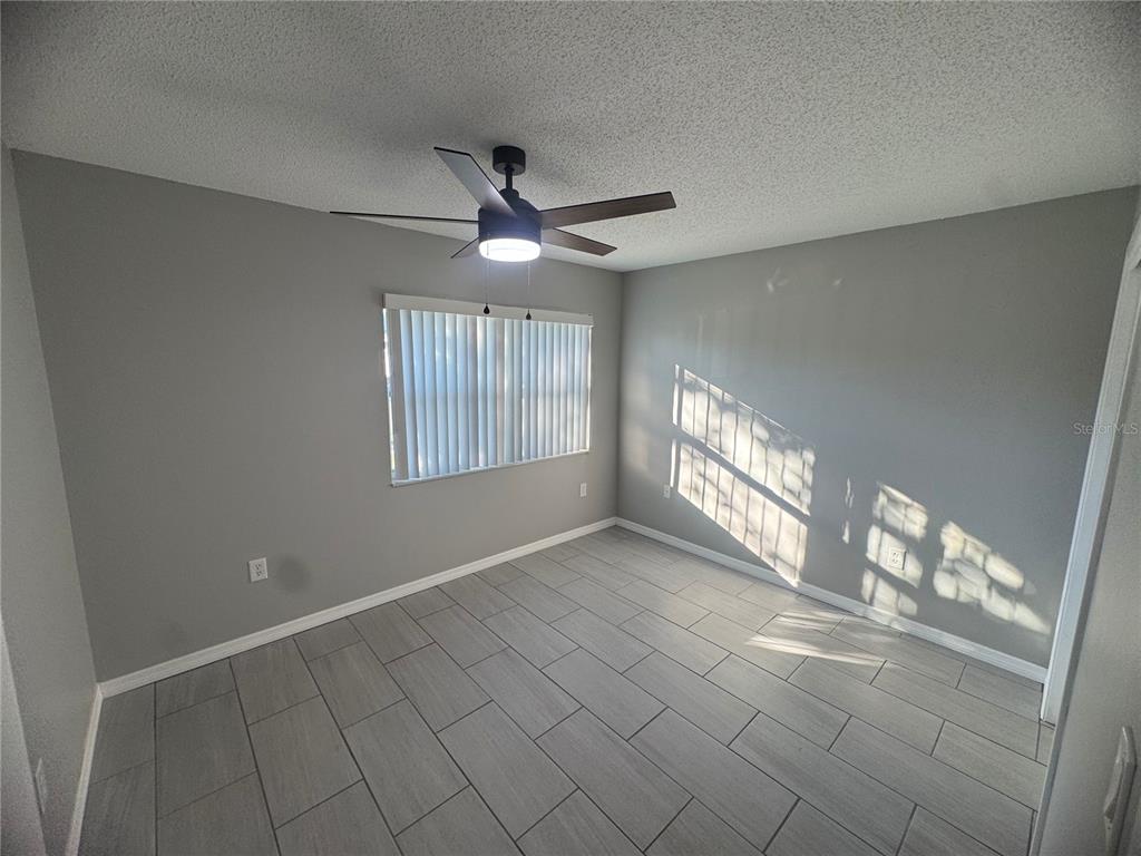 13016 Sirius Lane Hudson, FL 34667 - Photo 10 of 13 a view of an empty room with a window