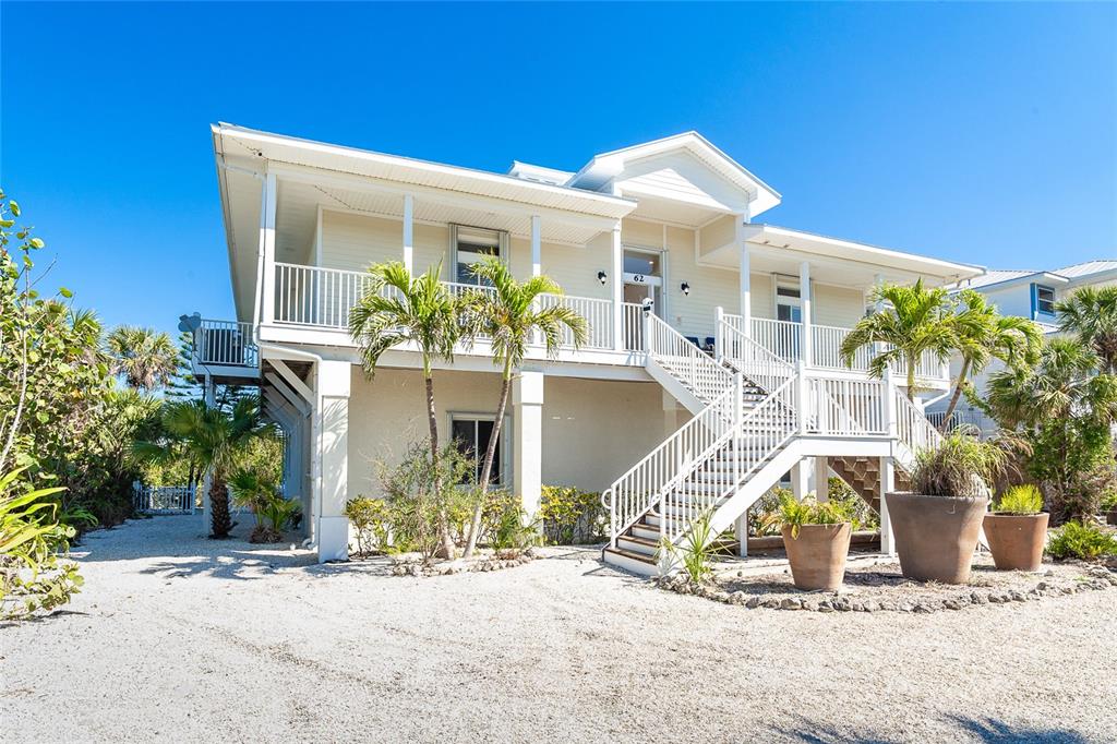 front view of house with potted plants