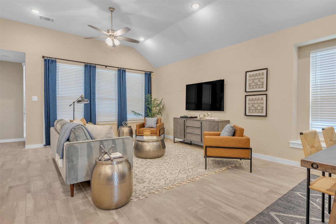 153 Billowing Way Kyle, TX 78640 - Photo 11 of 22 a living room with furniture a flat screen tv and a window