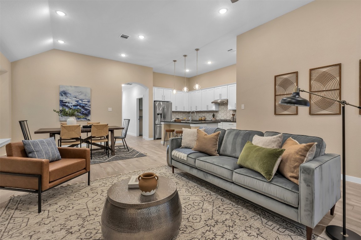153 Billowing Way Kyle, TX 78640 - Photo 14 of 22 a view of a living room kitchen and a wooden floor