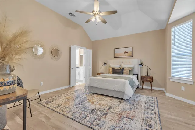 a bedroom with a bed and a table