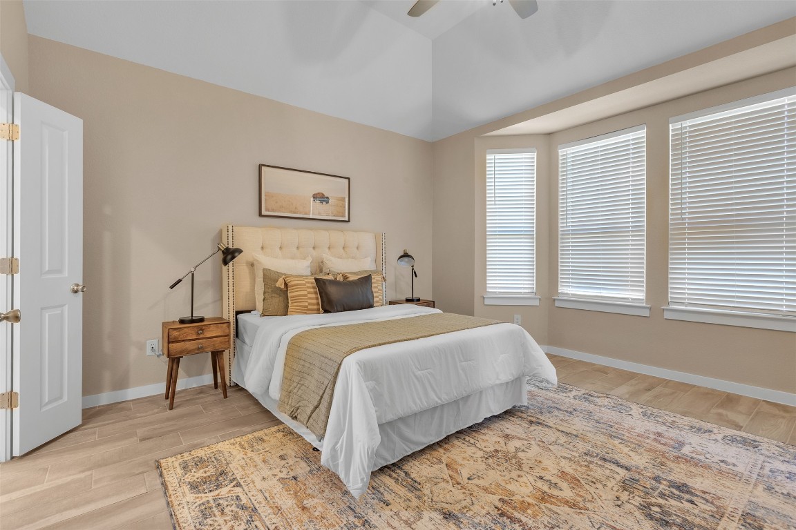 153 Billowing Way Kyle, TX 78640 - Photo 18 of 22 a bedroom with a bed and a window