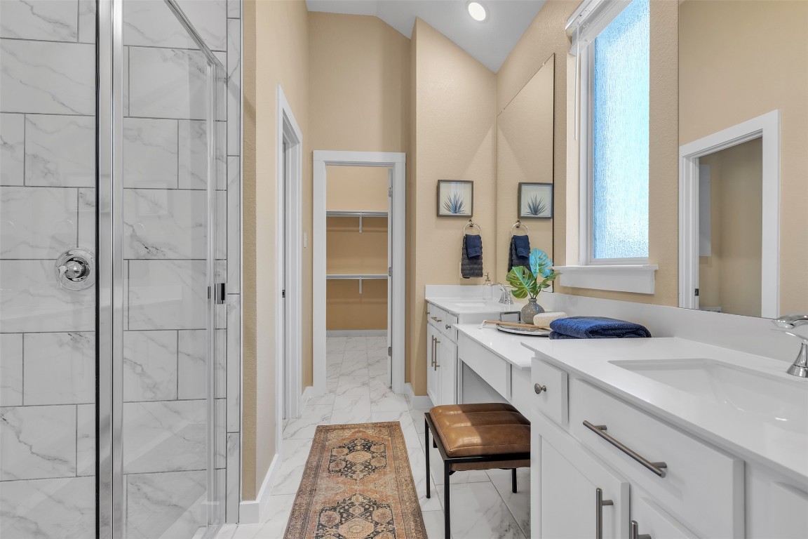 153 Billowing Way Kyle, TX 78640 - Photo 19 of 22 a bathroom with a sink and a mirror