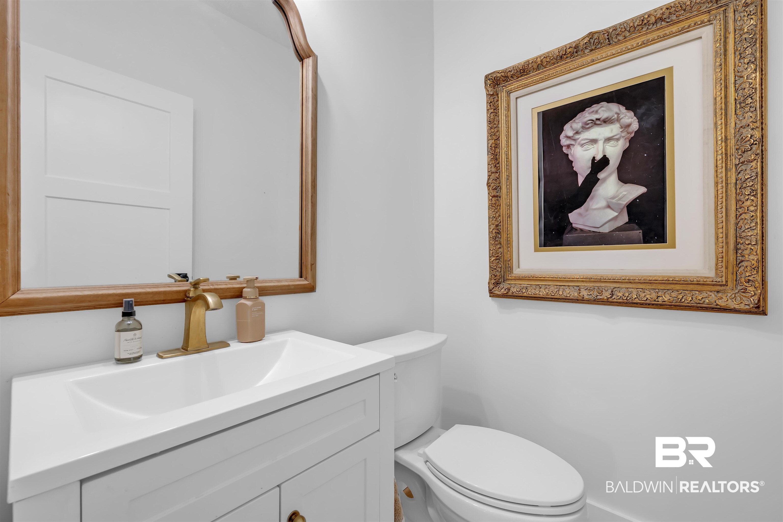 19058 James Road Gulf Shores, AL 36542 - Photo 19 of 49 Half bath featuring vanity and toilet