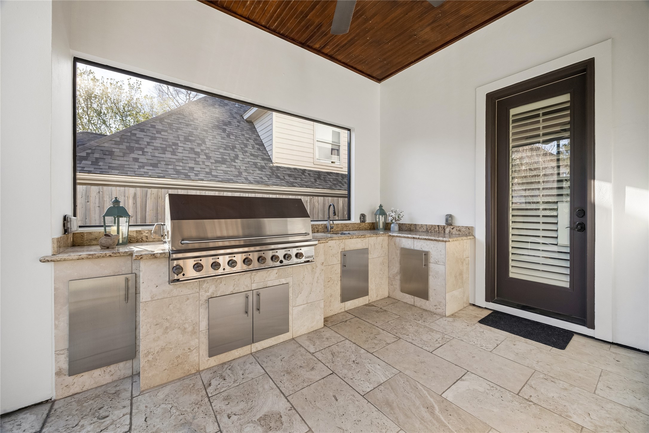 4511 Merrie Lane Bellaire, TX 77401 - Photo 43 of 46 a kitchen with a stove a sink and a refrigerator