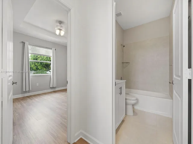 a bathroom with a sink toilet and bathtub