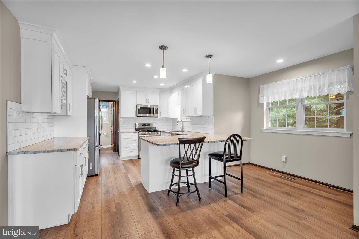 50 Wayside Road Berlin, NJ 08009 - Photo 3 of 35 Modern kitchen with warm wood tones.